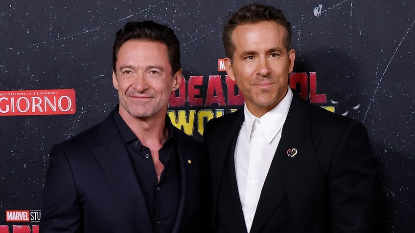 Hugh Jackman and Ryan Reynolds posing together