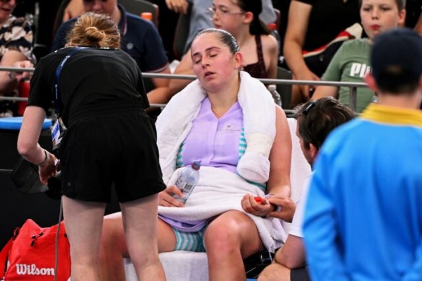 Latvia's Jelena Ostapenko receives treatment during her women's singles match against Karolina Pliskova at the Brisbane International