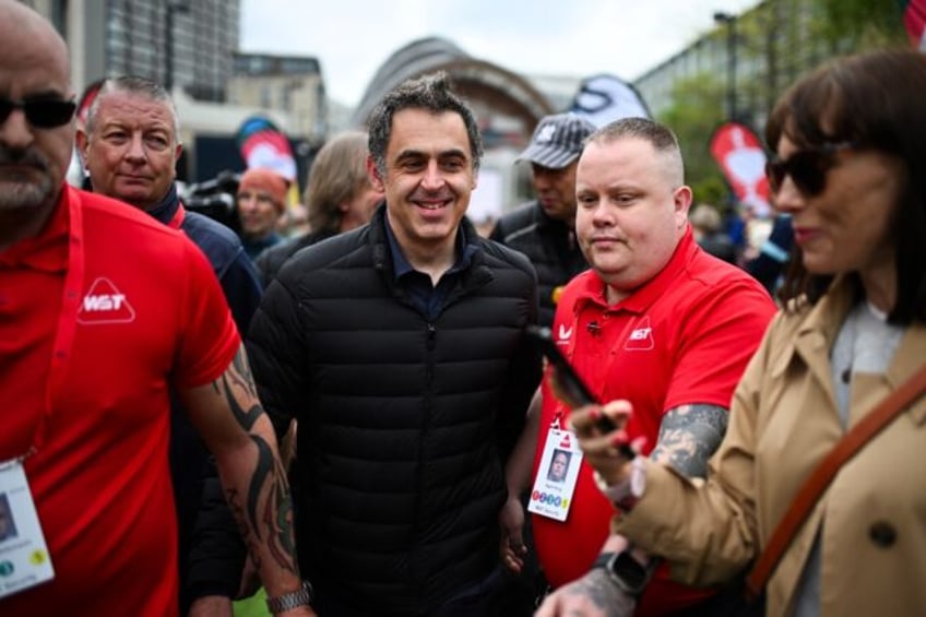 Fans' favourite: Seven-time winner Ronnie O'Sullivan (C) pictured outside the Crucible The