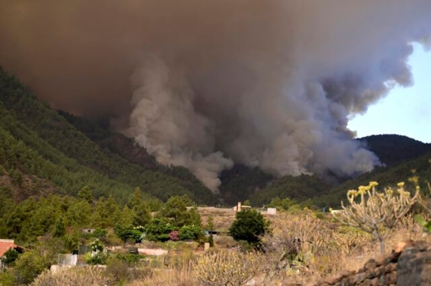 out of control wildfire scorches spains tenerife island affecting thousands