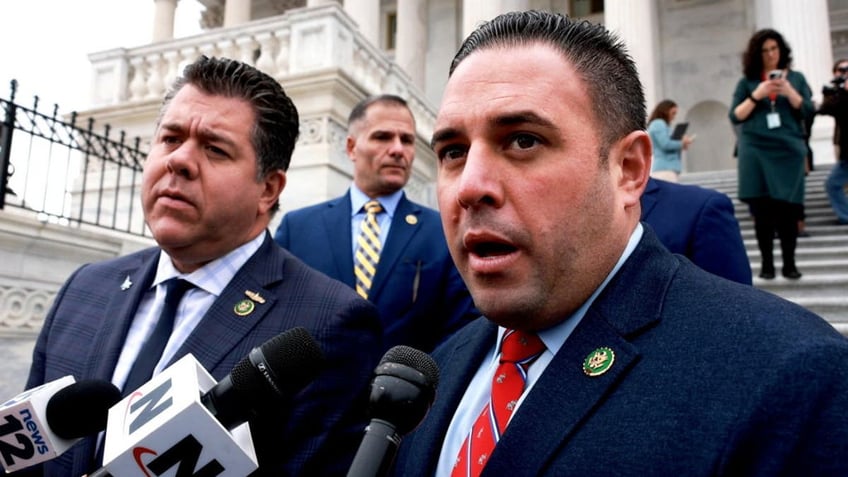 Long Island Republican Reps. Nick LaLota, left, and Anthony D'Esposito speak to reporters outside the Capitol Building in Washington, D.C., after George Santos was expelled from Congress on Dec. 1, 2023.