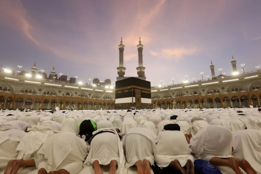 Pilgrims pray at Mecca's Grand Mosque as the annual hajj kicks off in the Muslim holy plac