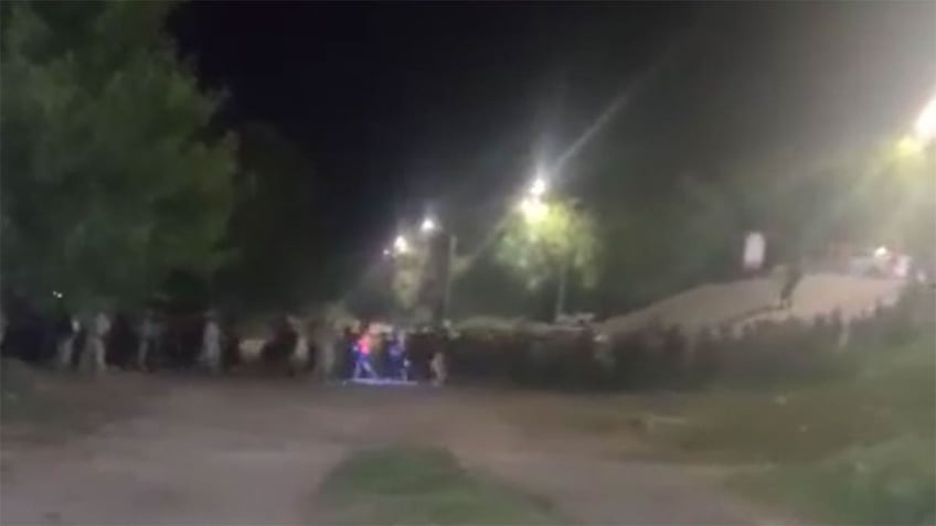 over 2200 migrants caught on video illegally crossing border near eagle pass texas overnight sources say