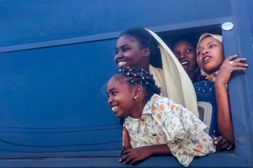 Displaced Sudanese bid farewell to locals in Port Sudan on January 7, 2025 as they embark