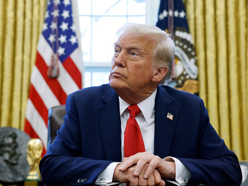 U.S. President Donald Trump speaks to reporters in the Oval Office of the White House on F