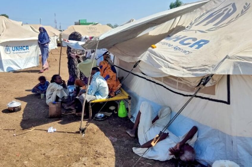 Sudanese who fled violence in Al-Jazira state rest at a camp for the displaced in the east