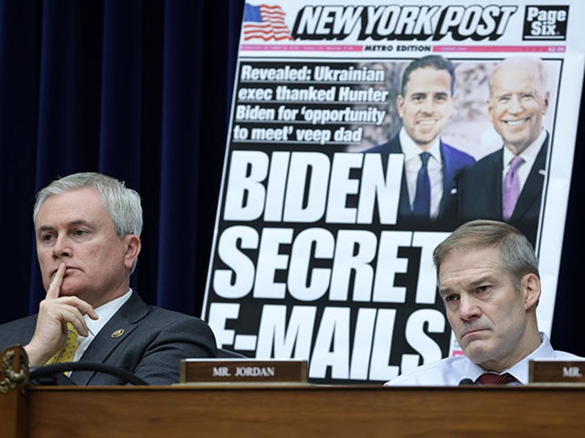 With a poster of a New York Post front page story about Hunter Biden’s emails on display