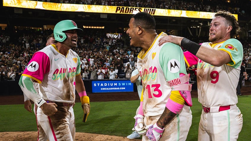 Manny Machado celebrates with team