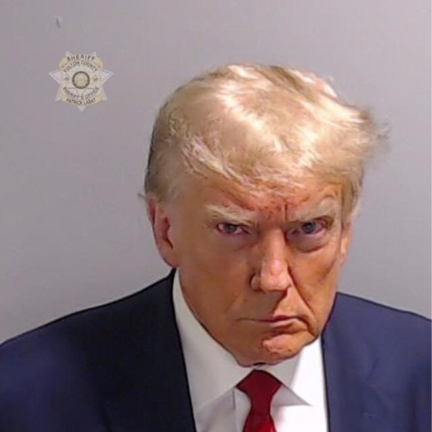 own it trump embraces historic mug shot