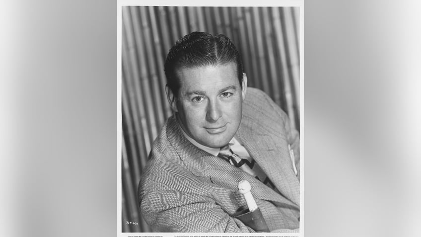 Don DeFore in a suit posing for the camera.