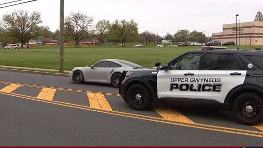 A police car in front of Pennbrook Middle School