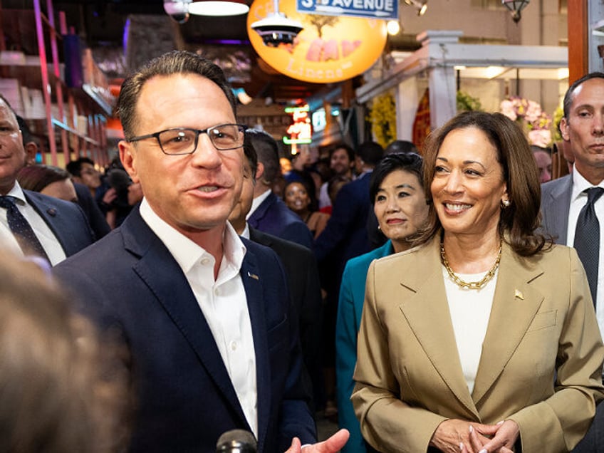 Vice President Kamala Harris and Pennsylvania Governor Josh Shapiro (L) speak to the press