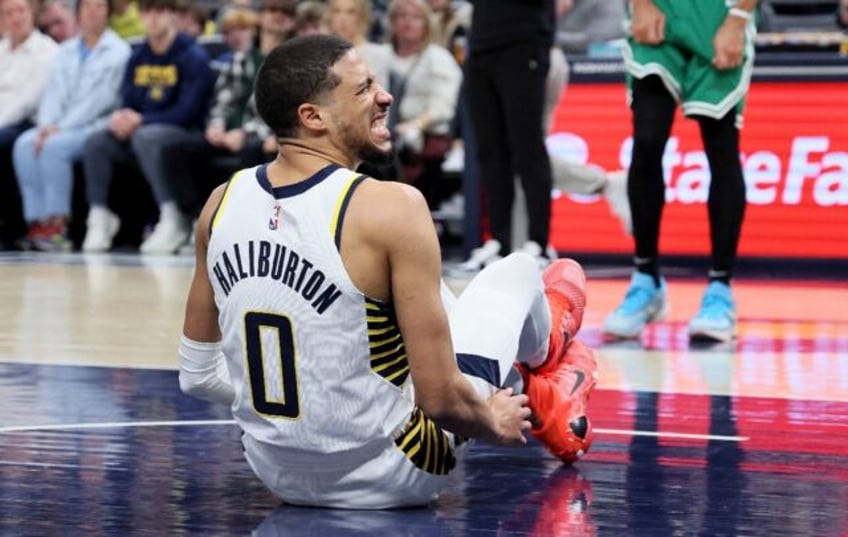 Indiana's Tyrese Haliburton grimaces after injuring his hamstring in the Pacers win over Boston on Monday