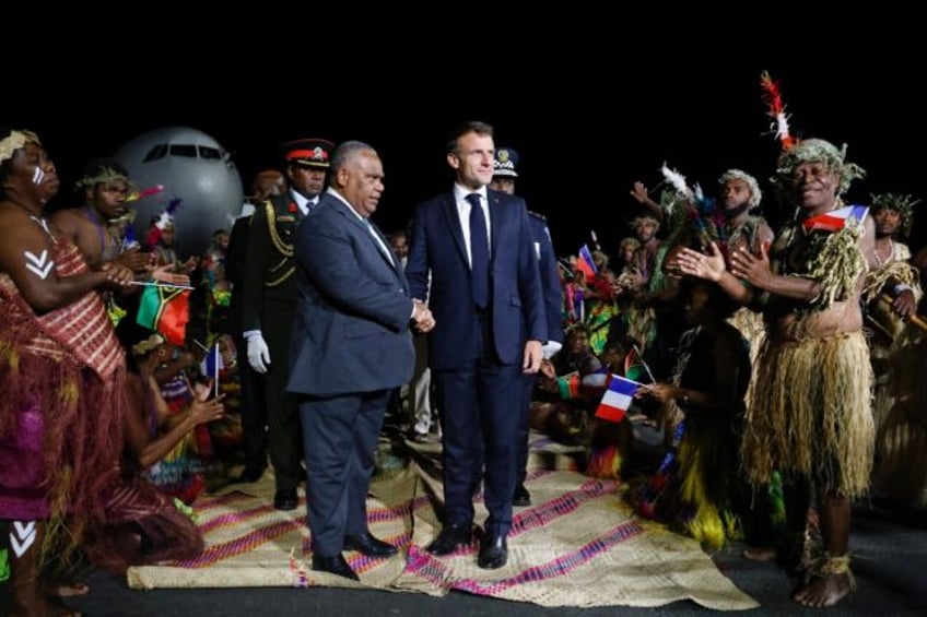 Jotham Napat, pictured meeting French President Emmanuel Macron (R) in April 2023, was a s