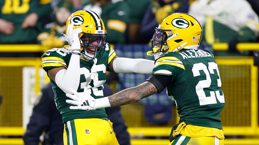 Packers defenders celebrate play