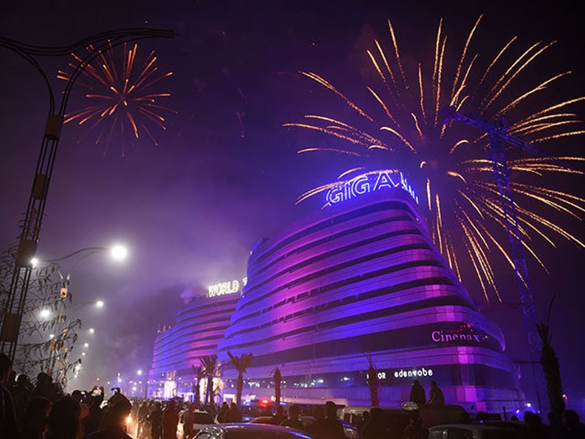 Pakistanis watch the fireworks display during the New Year celebrations in Rawalpindi on January 1, 2019. (Photo by FAROOQ NAEEM / AFP) (Photo credit should read FAROOQ NAEEM/AFP via Getty Images)