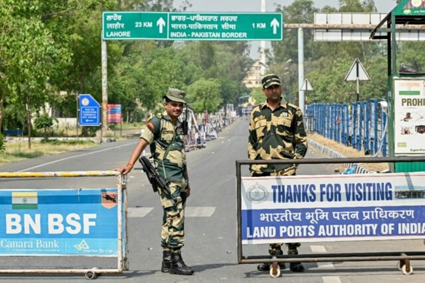 Indian Border Security Force personnel stand guard near the India-Pakistan Wagah border po