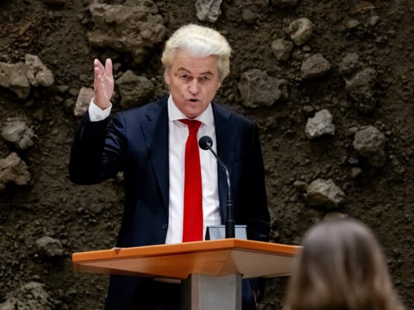 Netherlands' PVV party leader Geert Wilders gestures as he addresses the debate on the gov