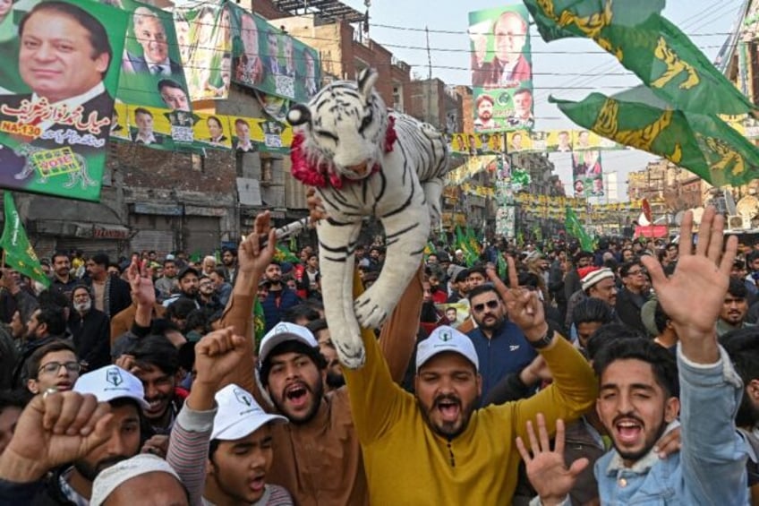 Supporters of Nawaz Sharif, Pakistan's former prime minister and leader of the Pakistan Muslim League (PML) party, attend an election campaign rally in Lahore in January