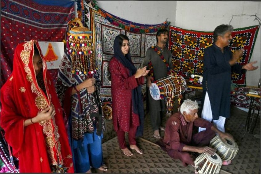 Members of the NGO Sujag Sansar put on a performance to create awareness of underage marri