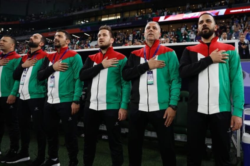 Palestine's coach Makram Daboub (second right) said his side would "regain our confidence and achieve our goal of reaching the last 16".