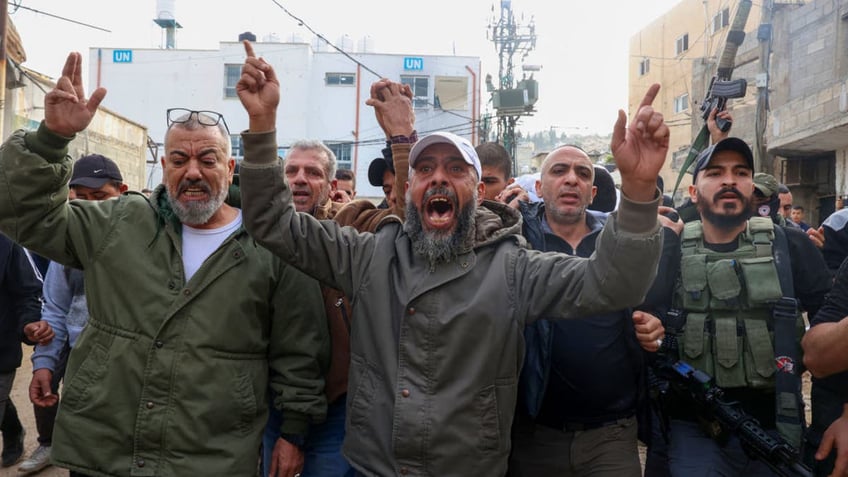 Mourners shout during the funeral of 19-year-old Rahbi Shalabi, who was killed during clashes between Palestinian security forces and militants a day earlier, in the occupied West Bank city of Jenin on Dec. 10, 2024.