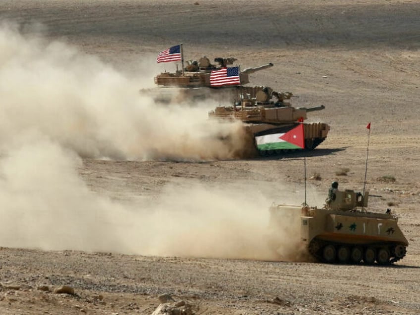 A Jordanian armored personnel carrier and U.S. tanks take part in the "Eager Lion" multinational military exercises in Jordan in September 2022. The U.S., Jordan and 28 partner nations took part in the exercises, representing one of the largest military exercises in the region. Khalil Mazraawi/AFP via Getty Images