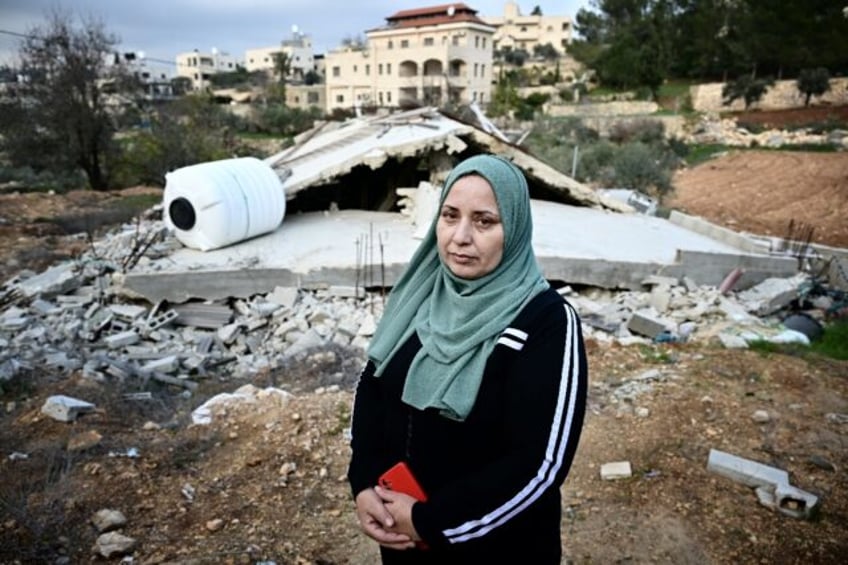 Palestinian villager Ghadeer al-Atrash in front of her bulldozed home in Al-Walaja