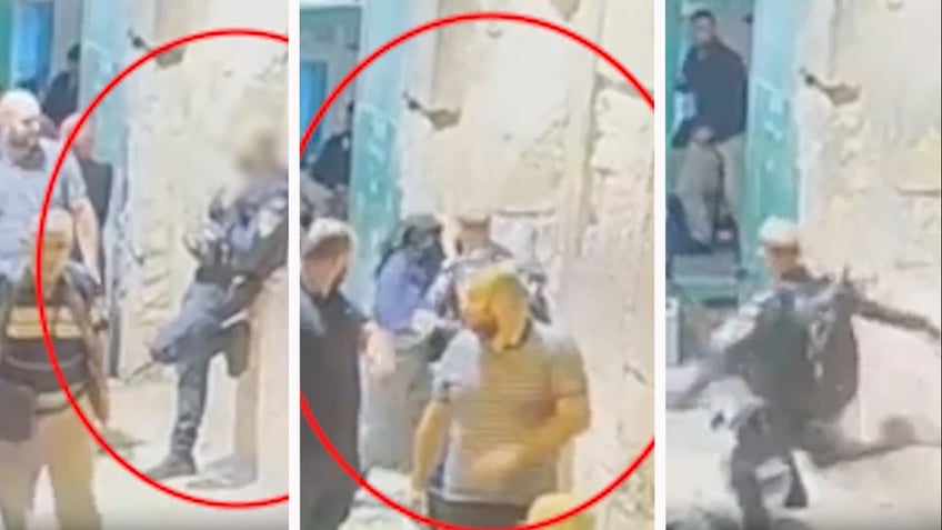 palestinian woman kicked knocked to ground after trying to stab israeli police officer in jerusalem