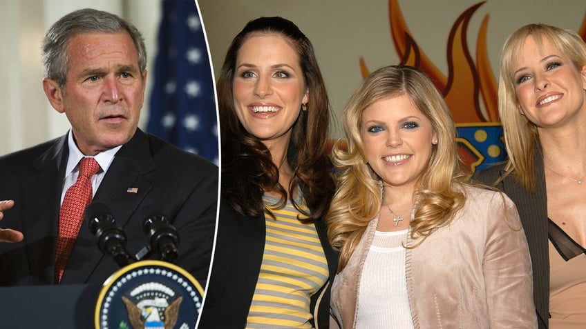 President George W. Bush in a black suit and red tie looks to his left behind the podium split the Dixie Chicks (Emily Robison, Natalie Maines and Martie Maguire) smile for a photo