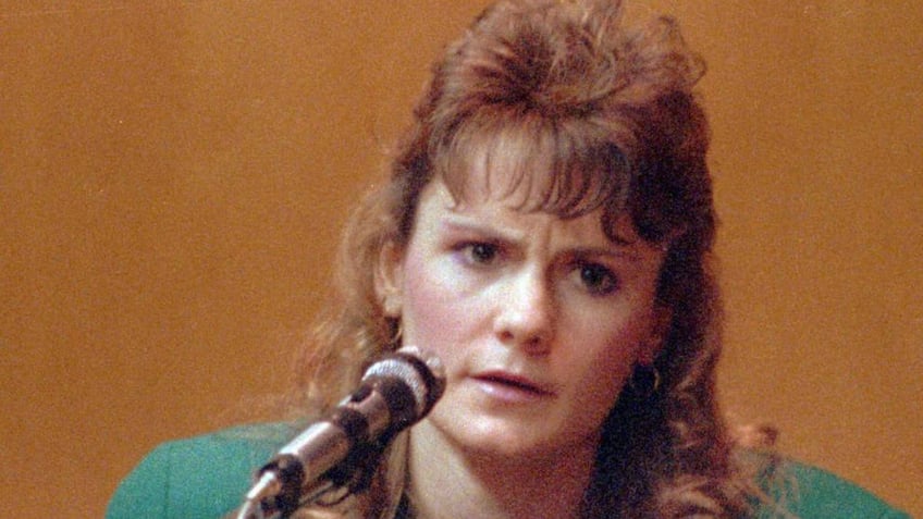 FILE - In this 1991 file photo Pamela Smart, testifies in Rockingham County Superior Court in Exeter, N.H. Patrick Randall held a knife to Gregory Smart's throat in May 1990 as Billy Flynn, who was Pamela Smart's teenage lover, shot him in the head. Flynn was paroled last month; Smart is serving life without parole after being convicted of plotting the murder. (AP Photo/Jim Cole, File)