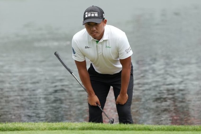 C.T. Pan of Taiwan lines up a putt n the way to a share of the halfway lead at the US PGA