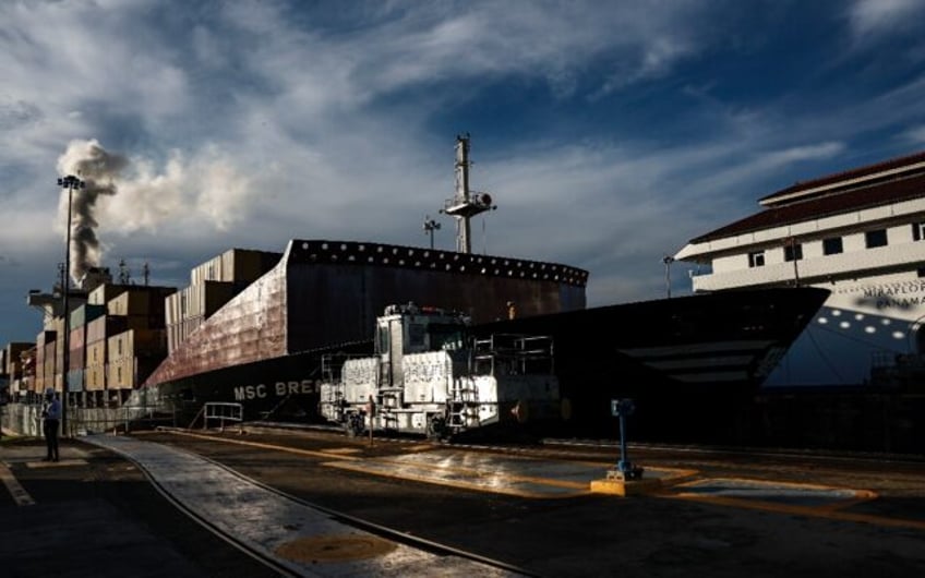 A cargo ship passes through the Miraflores locks on the Panama Canal