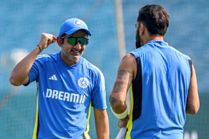 India head coach Gautam Gambhir talks to Virat Kohli during a practice session in Pune