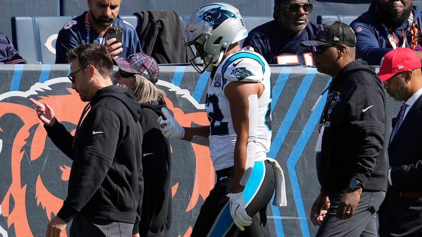 Tommy Tremble walks to the locker room