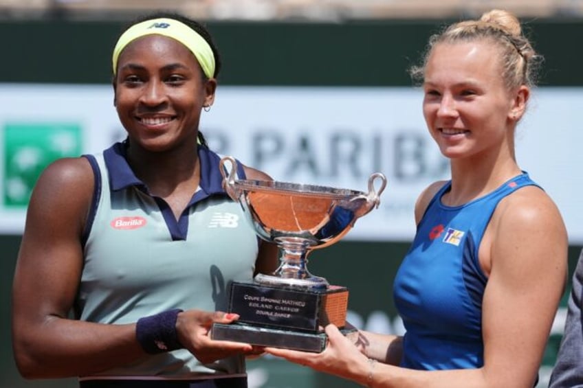 Coco Gauff (L) has now won Grand Slam titles in both singles and doubles at the age of jus