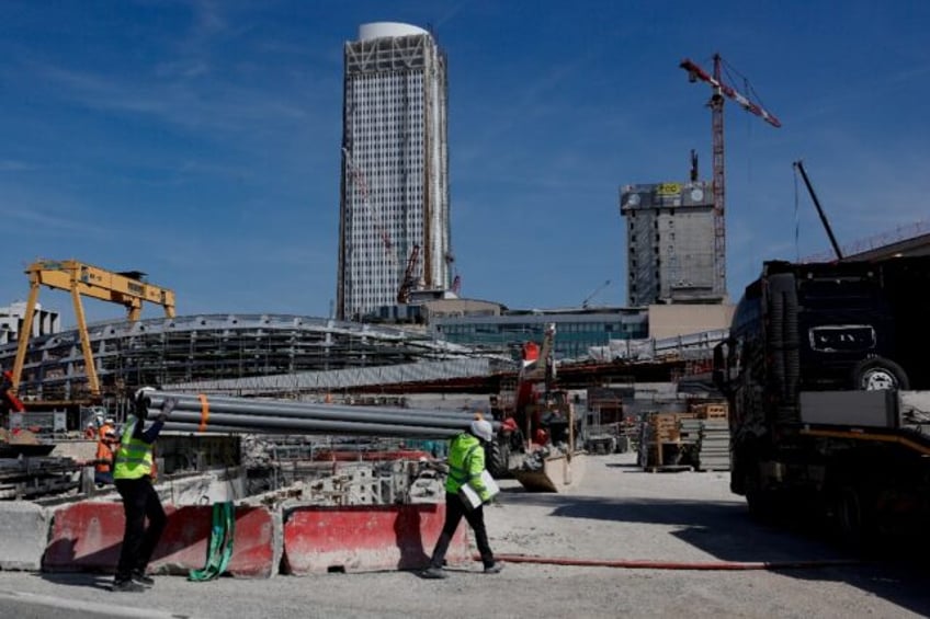 New transport infrastructure and housing are transforming the Saint-Ouen suburb north of Paris, seen here with the Tour Pleyel in the background