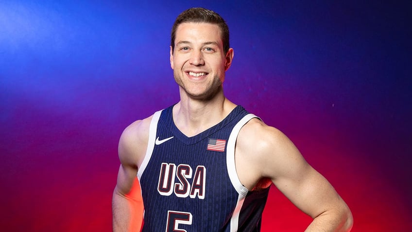 Jimmer Fredette poses