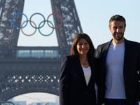 Paris Olympics organizers unveil a display of the five Olympic rings mounted on the Eiffel Tower