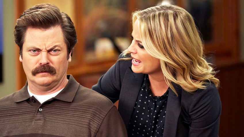 Nick Offerman as Ron Swanson and Amy Poehler as Leslie Knope