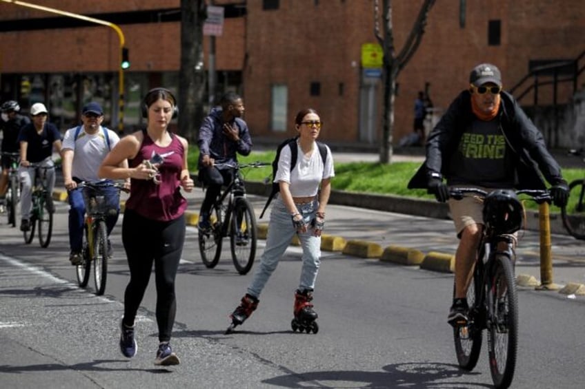 An estimated 1.7 million Bogotanos walk, cycle, jog, rollerblade, scoot, ride unicycles, p