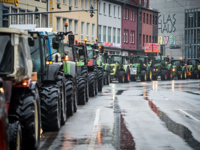 29 December 2023, North Rhine-Westphalia, Siegen: With a convoy of several hundred tractors, farmers in the Siegen area protested on Friday against the savings plans of the traffic light coalition. Photo: Christian Knieps/dpa (Photo by Christian Knieps/picture alliance via Getty Images)