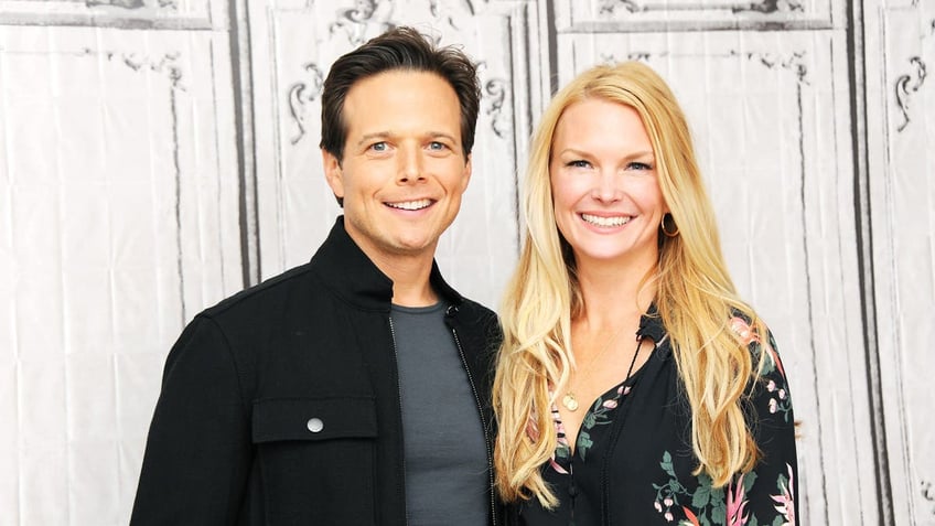 kelley and scott wolf smiling in 2016