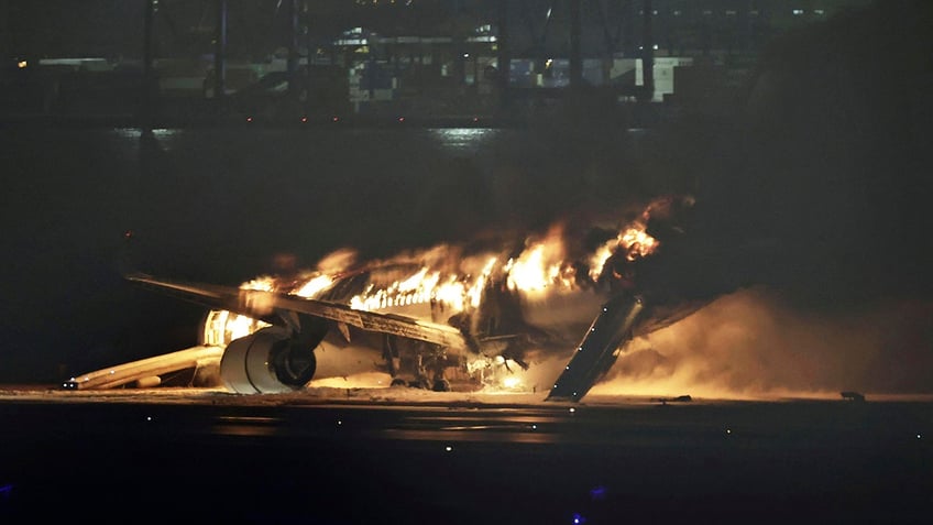 Fire, smoke rising from a plane