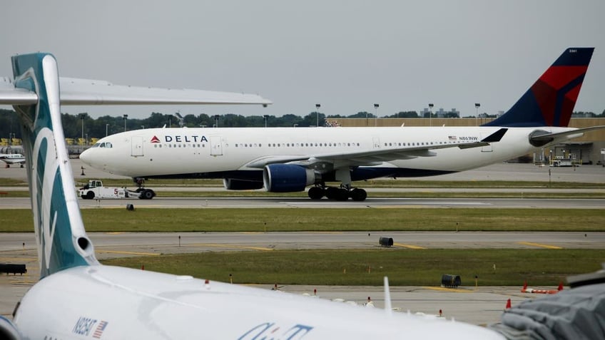 Delta plane on runway