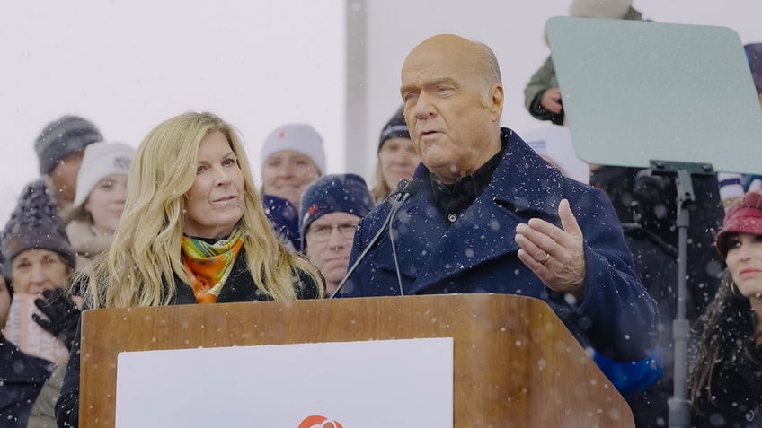 Pastor Greg Laurie and his wife at a podium