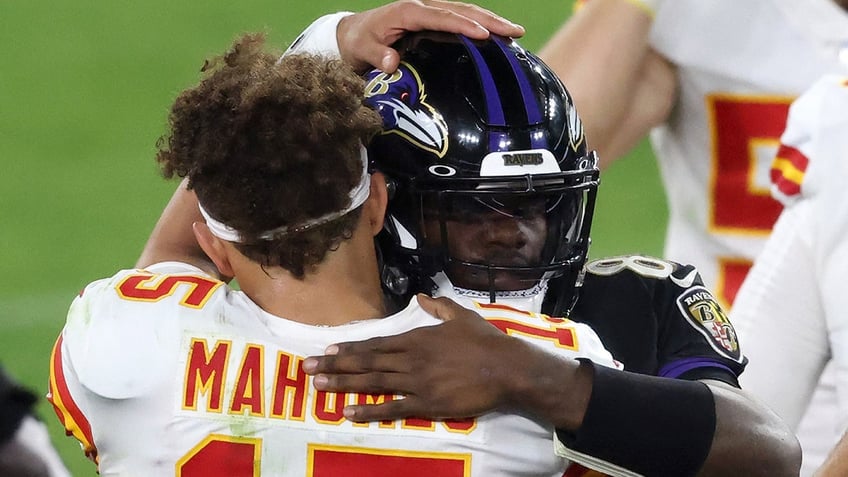 Patrick Mahomes and Lamar Jackson embrace