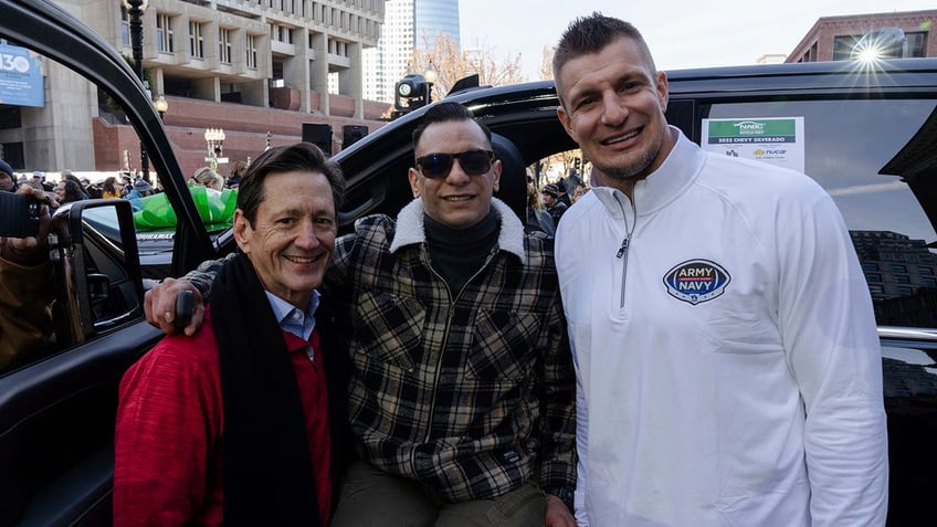 USAA CEO Wayne Peacock, Robert Trevino (U.S. Army), and NFL legend Rob Gronkowski at USAA event