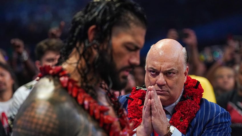 Paul Heyman and Roman Reigns