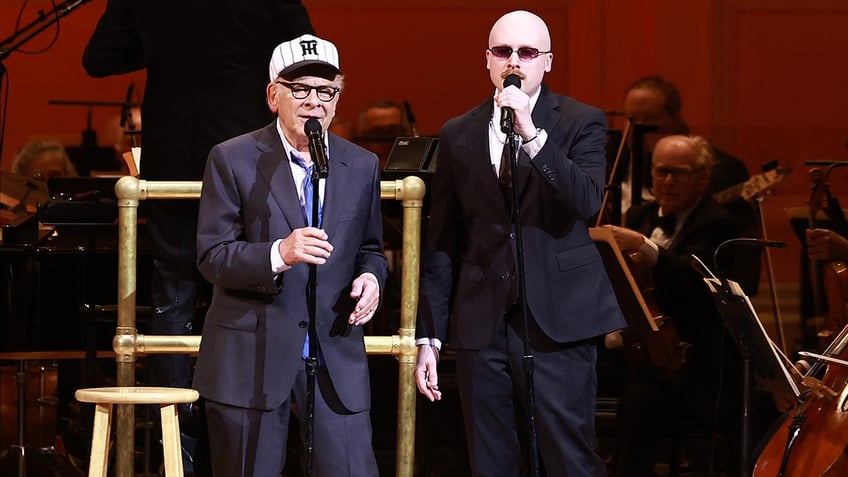 Art Garfunkel performing on stage with his son Art Garfunkel Jr